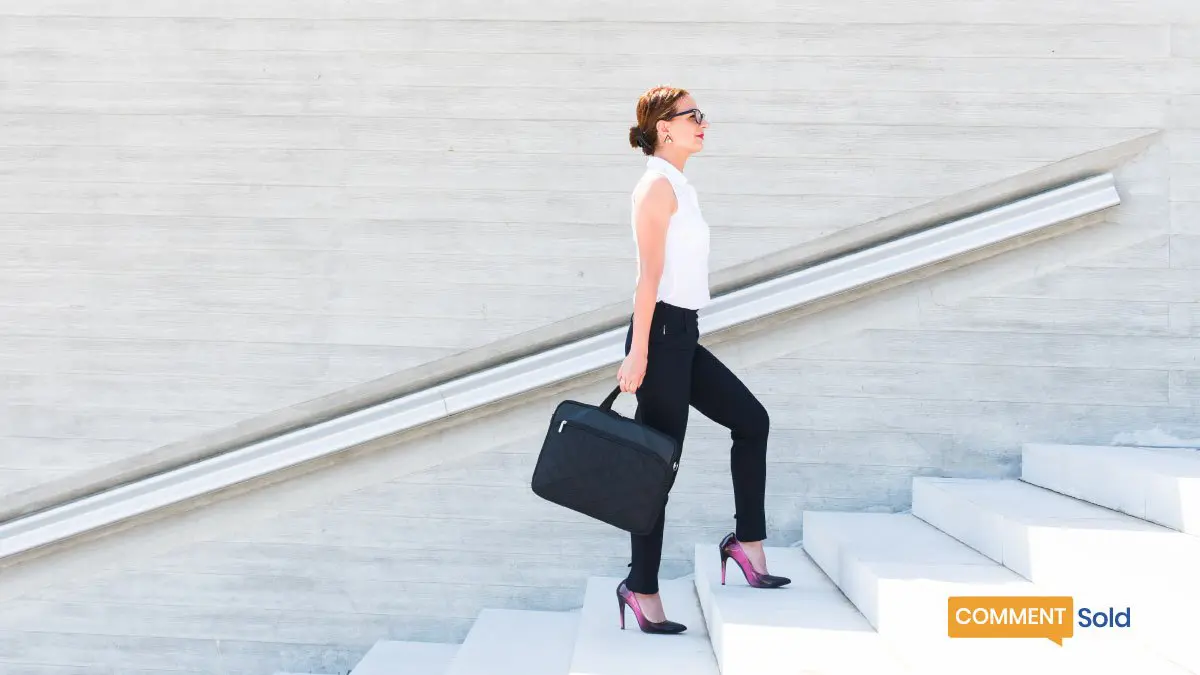 woman going up stairs with bag