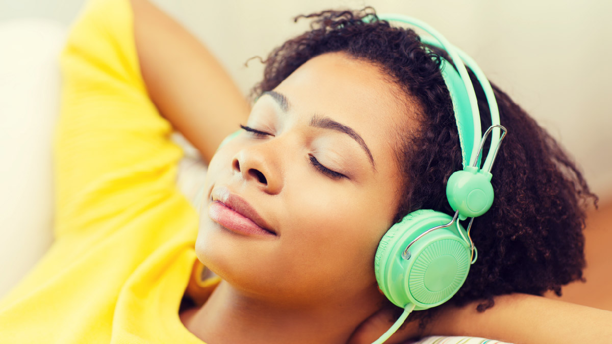 Woman relaxing while listening to music