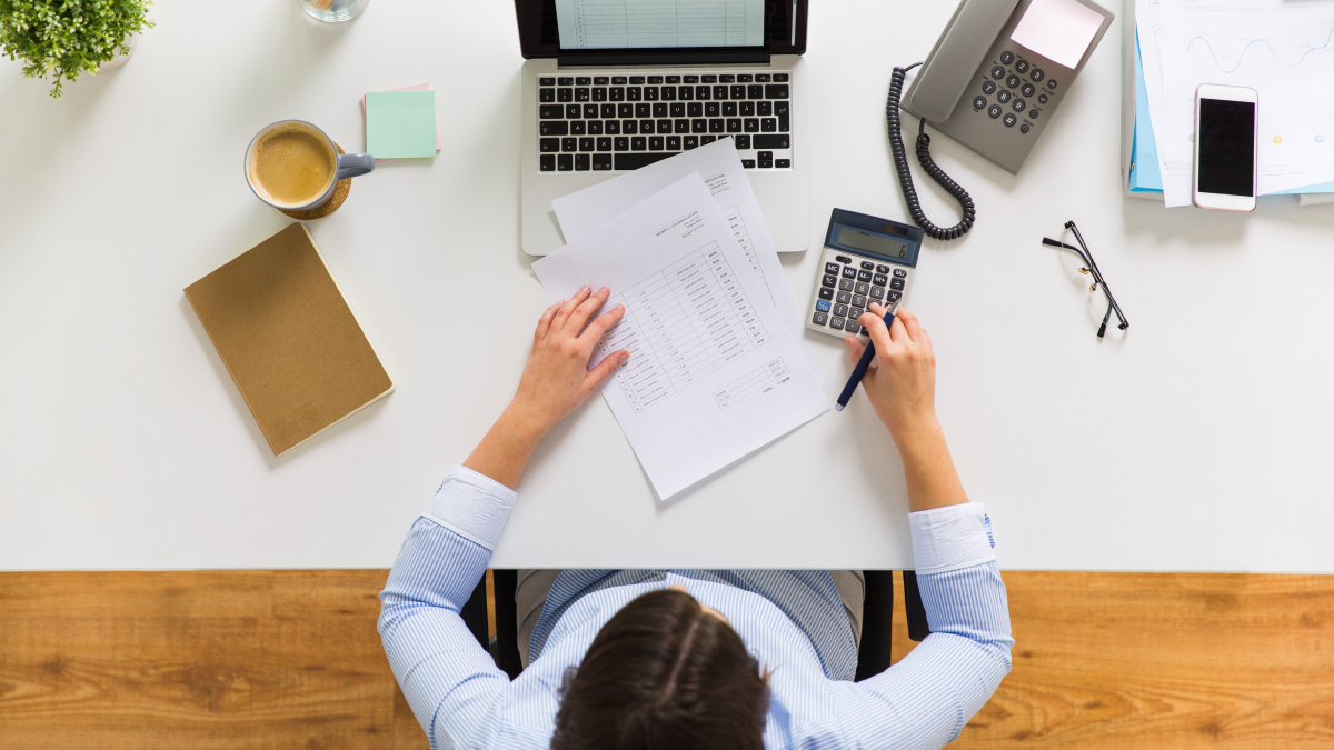 Bookkeeping woman sits down to calculate cash flow statements. 