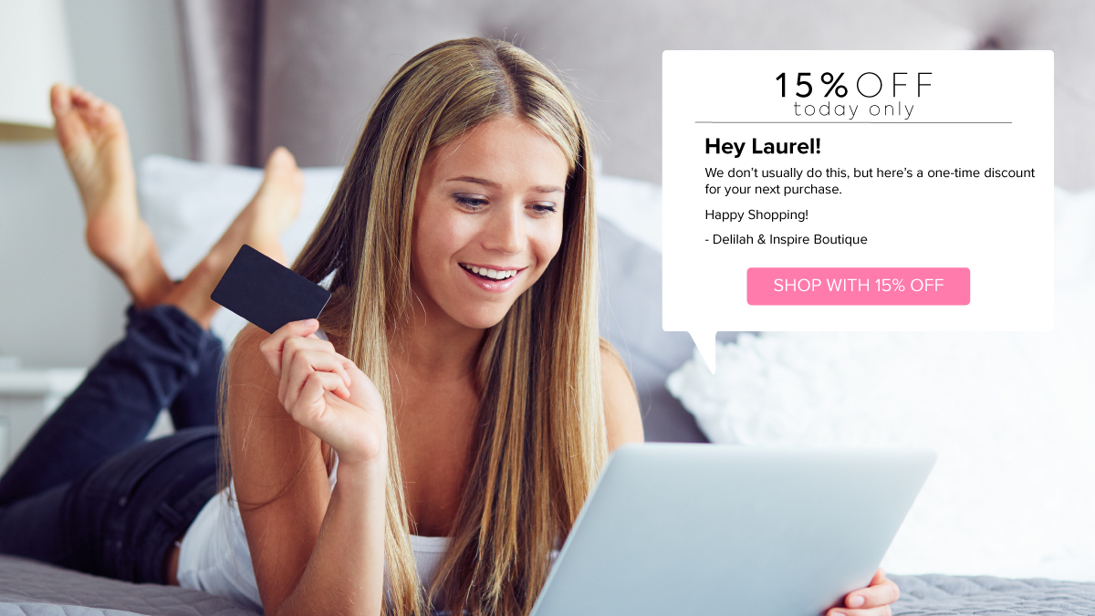 Smiling woman laying on bed looks at her iPad where she's received a 15% discount to win back her customer loyalty.