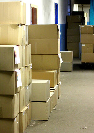 Boxes of inventory sitting in a warehouse