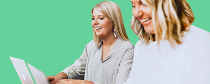 women smiling while online shopping