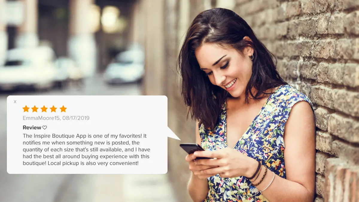 Woman reviewing her favorite boutique's app on her smartphone.